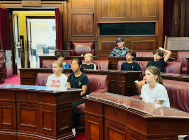 Year 6 students sitting in the the senate in Parliament House.