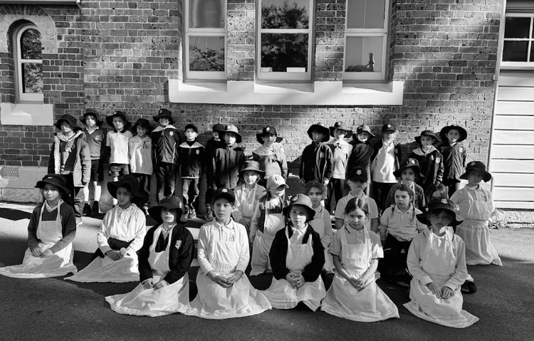 Year 2 students in old fashioned dress at their excursion to the NSW Schoolhouse Museum of Public Education.